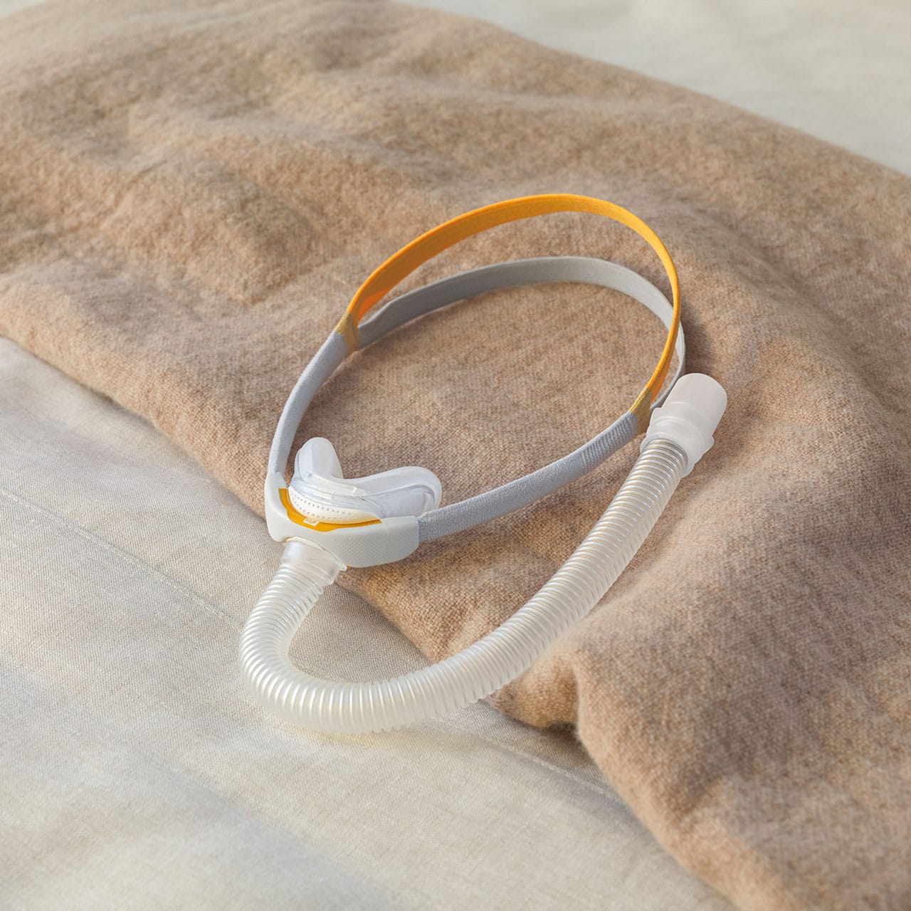 The F&P Solo Mask on a bed